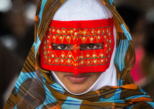 a bandari woman wearing a traditional mask called the burqa at panjshambe bazar thursday market, Hormozgan, Minab, Iran