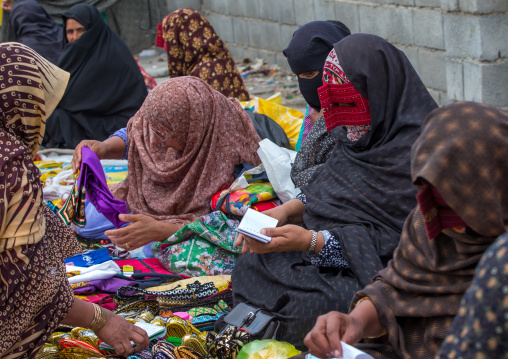 a bandari woman wearing a traditional mask called the burqa at panjshambe bazar thursday market, Hormozgan, Minab, Iran