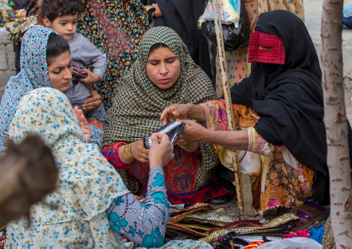 a bandari woman wearing a traditional mask called the burqa at panjshambe bazar thursday market, Hormozgan, Minab, Iran