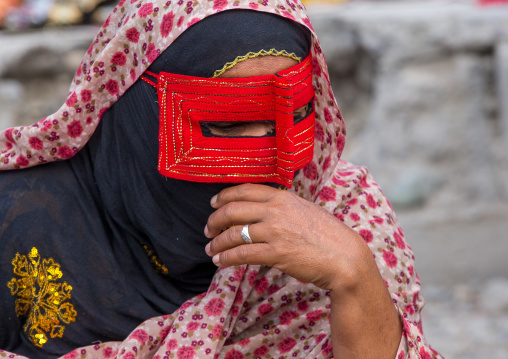 a bandari woman wearing a traditional mask called the burqa at panjshambe bazar thursday market, Hormozgan, Minab, Iran