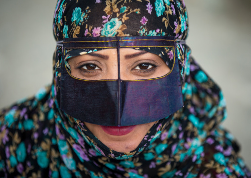 a bandari woman wearing a traditional mask called the burqa at panjshambe bazar thursday market, Hormozgan, Minab, Iran