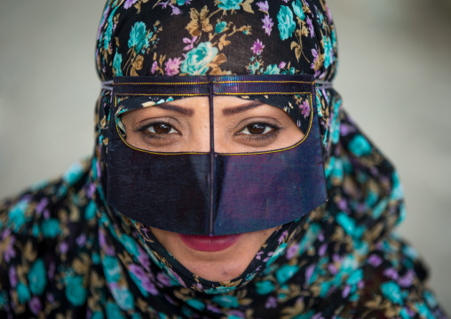 a bandari woman wearing a traditional mask called the burqa at panjshambe bazar thursday market, Hormozgan, Minab, Iran