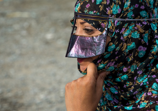 a bandari woman wearing a traditional mask called the burqa at panjshambe bazar thursday market, Hormozgan, Minab, Iran