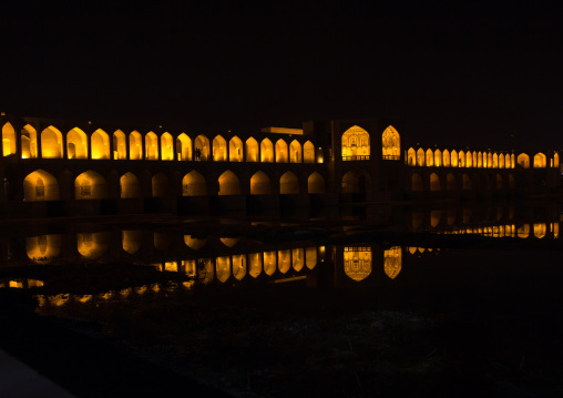 a view of the khaju bridge at night highlighting the arches, Isfahan Province, isfahan, Iran