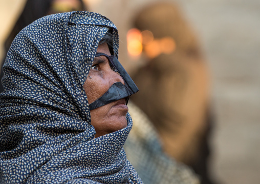 a bandari woman wearing a traditional mask called the burqa, Qeshm Island, Salakh, Iran