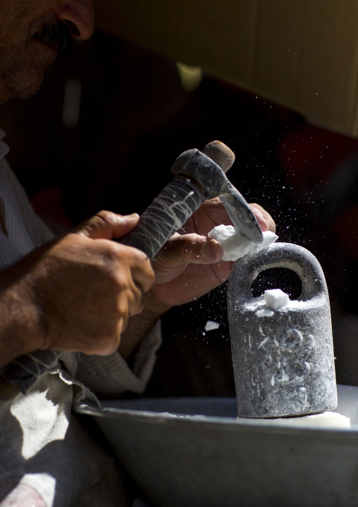 Man Crashing Sugar In The Bazaar, Sanandaj, Iran