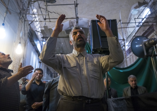 Men weeping and mourning in the bazaar, Isfahan province, Isfahan, Iran