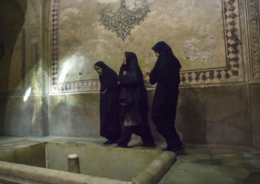 Veiled woman in the karim khan fort bath, Fars province, Shiraz, Iran