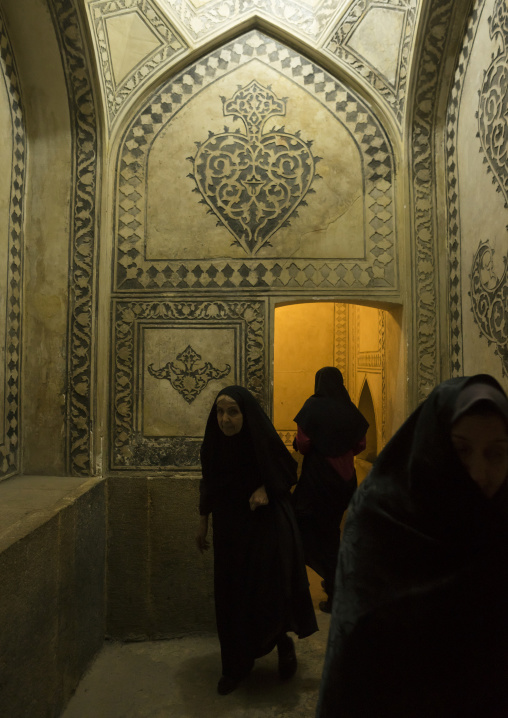 Veiled woman in the karim khan fort bath, Fars province, Shiraz, Iran