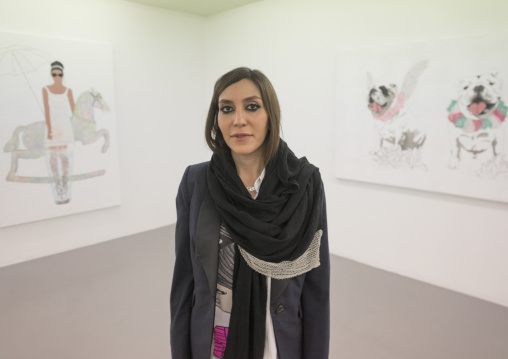 Elnaz pausing in front of her painting, Shemiranat county, Tehran, Iran