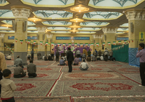 Pilgrims praying in front of the ayatollah khomeini mausoleum, Shemiranat county, Behesht-e zahra, Iran