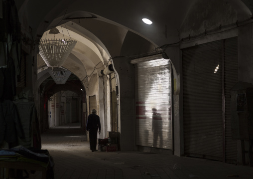 Man walking in the bazaar early in the morning, Isfahan province, Kashan, Iran