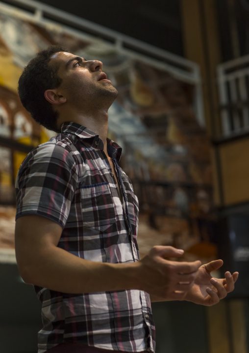 Man praying at the end of the traditional sport of zurkhaneh, Isfahan province, Kashan, Iran