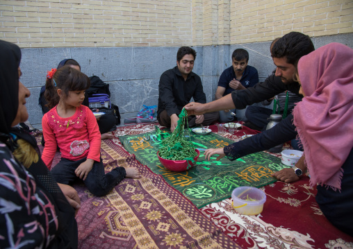 Iranian family who gives for free some prayer beads to mourners to see their wish happen, Isfahan Province, Isfahan, Iran