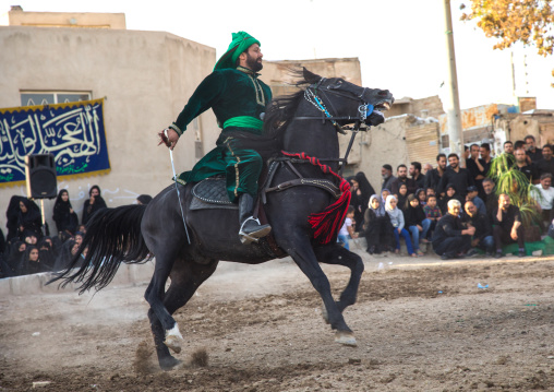 Man riding a horse during a traditional religious theatre called tazieh about Imam Hussein death in Kerbala, Isfahan Province, Isfahan, Iran