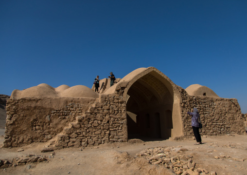 Tourists taking pictures in a zoroastrian old building, Yazd Province, Yazd, Iran