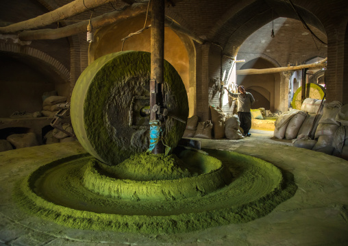 Worker in a traditional henna mill, Yazd Province, Yazd, Iran