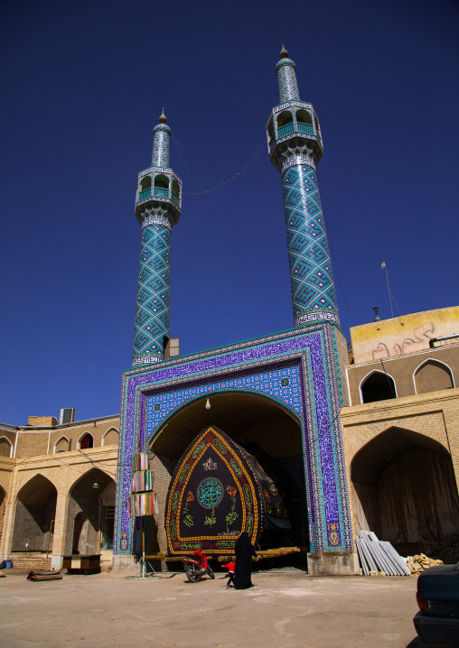 A nakhl and an alam made of clothes in front of a mosque during Muharram to commemorate the martyrdom anniversary of Hussein, Yazd Province, Yazd, Iran