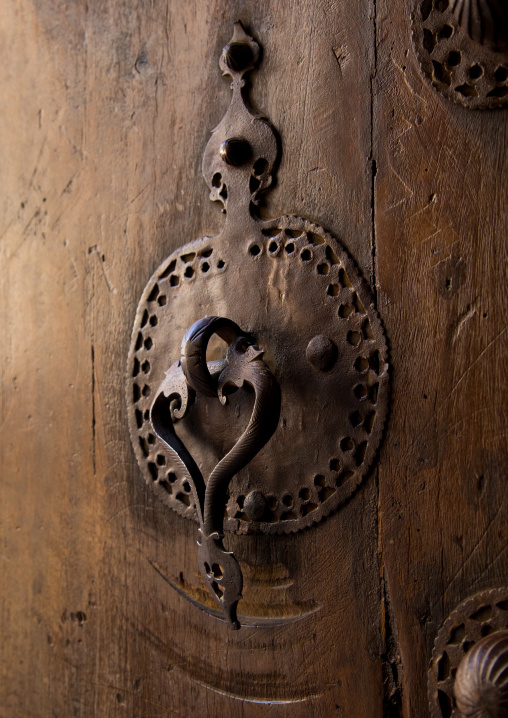 Ancient female doorknocker on a wooden door, Isfahan Province, Kashan, Iran