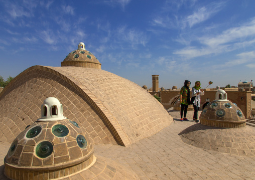 Chinese tourists taking selfie on sultan Amir ahmad bathhouse terrace, Isfahan Province, Kashan, Iran