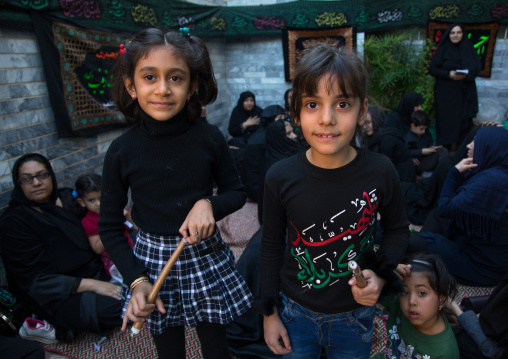 Iranian shiite girls with iron chains during Chehel Manbar festival on Tasua to commemorate the martyrdom anniversary of Hussein, Lorestan Province, Khorramabad, Iran