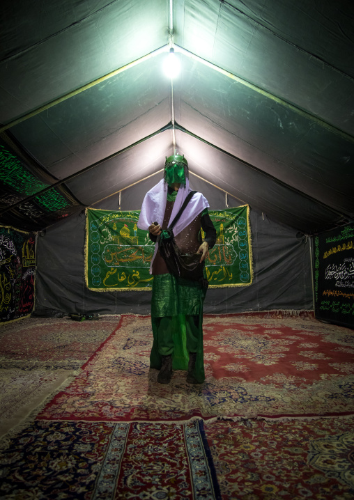 Man inside a tent and dressed as Imam Hussein during Ashura commemoration, Lorestan Province, Khorramabad, Iran