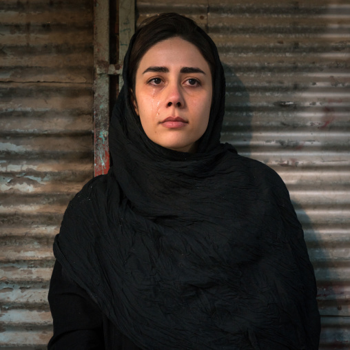 Iranian shiite muslim woman crying during the Kharrah Mali ritual to mark the Ashura ceremony, Lorestan Province, Khorramabad, Iran