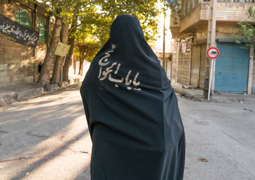 Iranian shiite muslim woman after rubbing mud on her chador during the Kharrah Mali ritual to mark the Ashura ceremony, Lorestan Province, Khorramabad, Iran