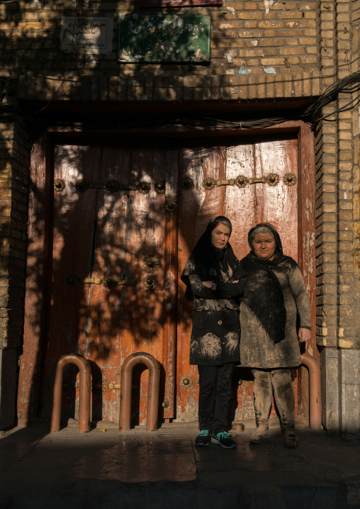 Iranian shiite muslim women with mud stains on their chadors during the Ashura day, Lorestan Province, Khorramabad, Iran