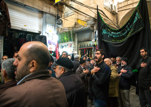 iranian shiite muslim men celebrating ashura in the bazaar, Central district, Tehran, Iran