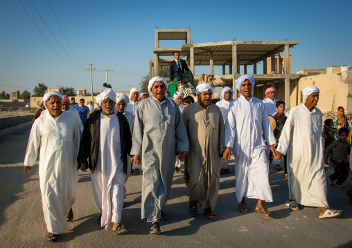 groom riding a camel during his wedding ceremony, Qeshm Island, Salakh, Iran