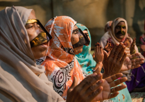 women with traditional burqas masks during a zar ceremony, Qeshm Island, Salakh, Iran