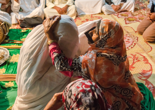 women with traditional burqas masks during a zar ceremony, Qeshm Island, Salakh, Iran