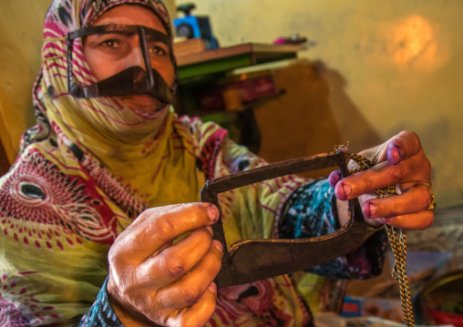 a bandari woman wearing a traditional mask called the burqa, Qeshm Island, Salakh, Iran