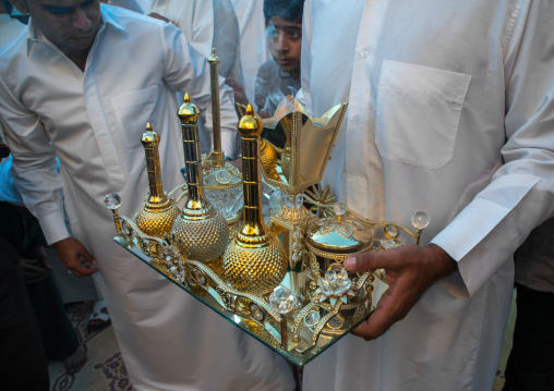 man carrying incense and perfumes for the wedding ceremony, Hormozgan, Bandar-e Kong, Iran