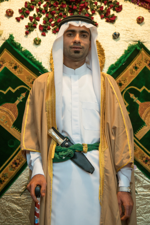 groom posing with his new traditional clothes during a wedding ceremony, Hormozgan, Bandar-e Kong, Iran