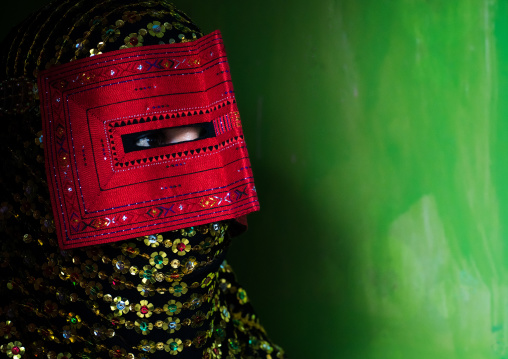 a bandari woman wearing a traditional mask called the burqa, Hormozgan, Minab, Iran