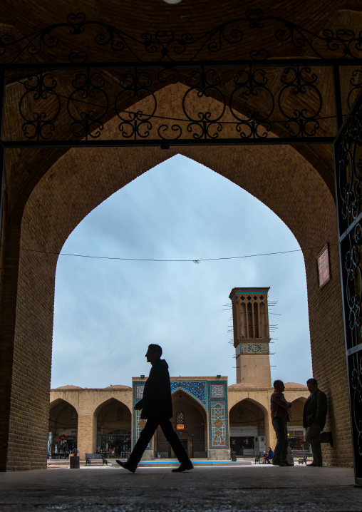 man passing in from of ganjali khan square, Central County, Kerman, Iran