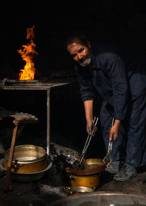 coppersmith in ganjali bazaar, Central County, Kerman, Iran