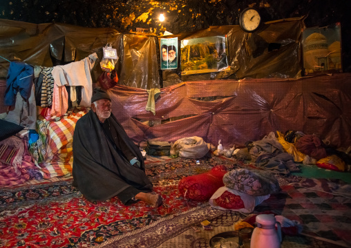 old man in his troglodyte house, Kerman province, Meymand, Iran