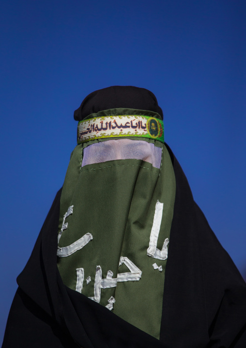 Iranian Shiite Muslim Woman Mourning Imam Hussein On The Day Of Tasua With Her Face Covered By A Veil, Lorestan Province, Khorramabad, Iran