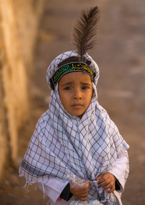 An Iranian Shiite Boy With A Feather On The Head During Tasua Celebrations One Day Before Ashura, Lorestan Province, Khorramabad, Iran