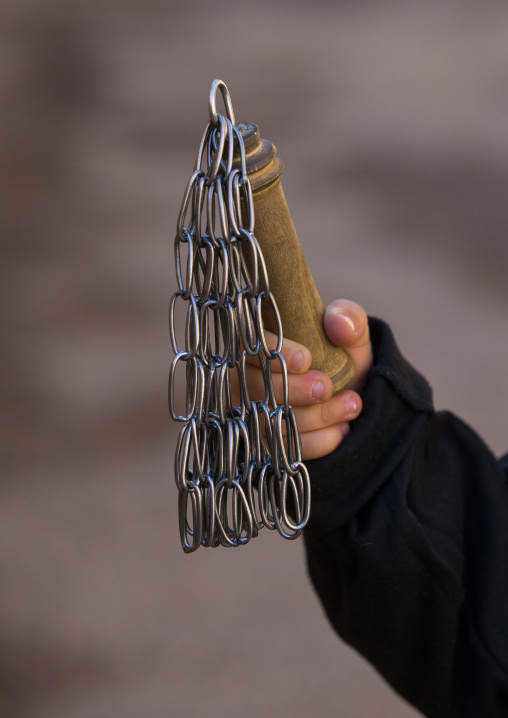 A Child Holds A Chain Used For Self-flagellation During Tasua Celebrations One Day Before Ashura, Lorestan Province, Khorramabad, Iran