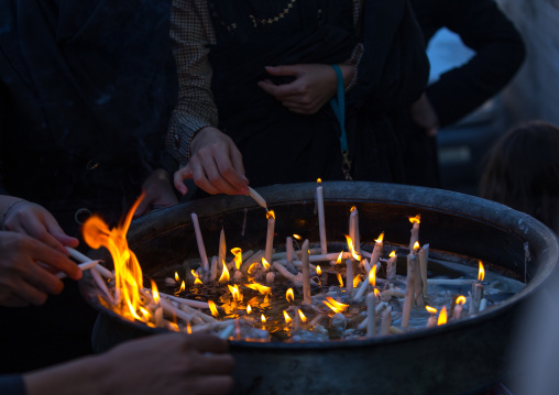 A Man Lights Candles During Chehel Menbari Festival On Tasu'a Day To Commemorate The Martyrdom Anniversary Of Imam Hussein, Lorestan Province, Khorramabad, Iran