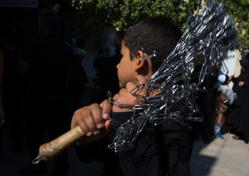 Iranian Shiite Boy Is Beating Himself With Iron Chains On Tasua Celebration, Lorestan Province, Khorramabad, Iran