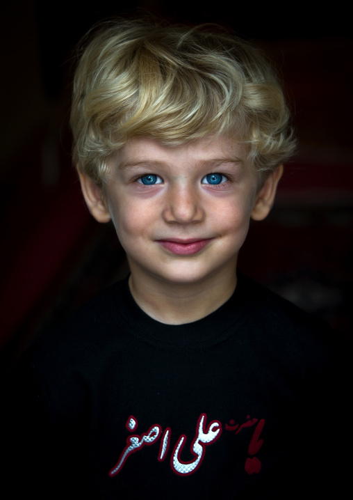 An Iranian Shiite Blonde Boy During Tasua Celebrations One Day Before Ashura, Lorestan Province, Khorramabad, Iran