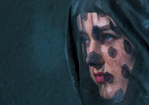 Iranian Shiite Muslim Woman Mourning Imam Hussein On The Day Of Tasua With Her Face Covered By A Veil, Lorestan Province, Khorramabad, Iran