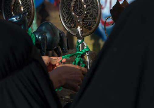 Iranian Shiite Women Putting Green Ribbons On An Alam To Make Wishes During Chehel Menbari Festival On Tasua Day, Lorestan Province, Khorramabad, Iran