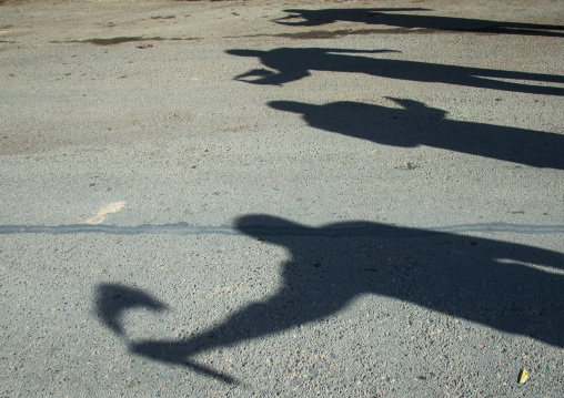 Shadows Of Iranian Shiite Men Who Are Beating Themselves With Iron Chains During Ashura, The Day Of The Death Of Imam Hussein, Kurdistan Province, Bijar, Iran