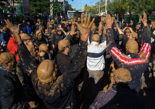 Iranian Shiite Muslim Men Covered In Mud, Chanting And Self-flagellating During Ashura, The Day Of The Death Of Imam Hussein, Kurdistan Province, Bijar, Iran